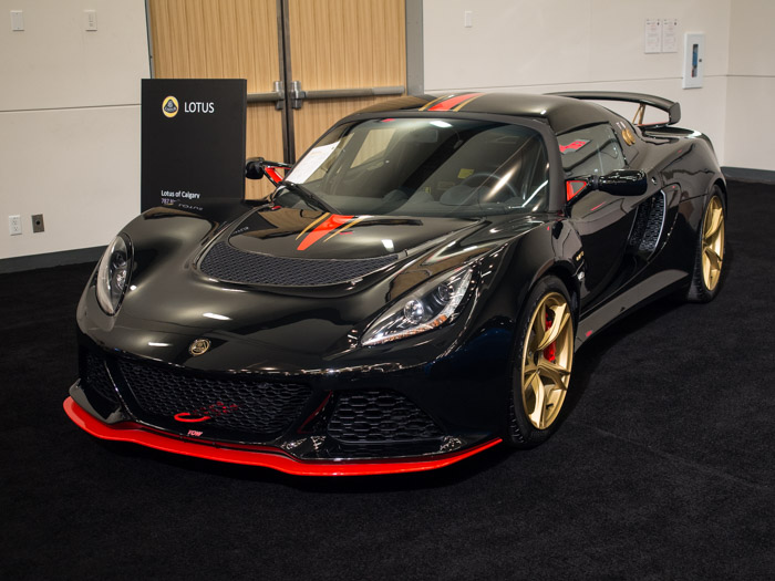 Black Lotus Exige parked in a showroom.