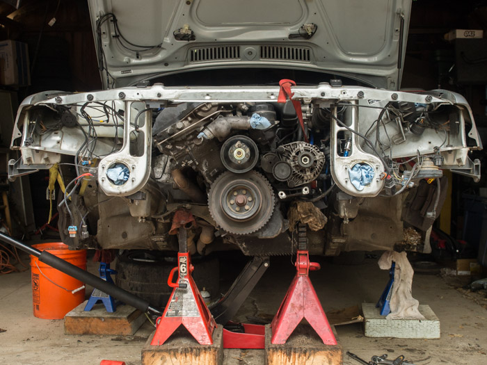 Nose of a BMW E36 with almost everything removed.